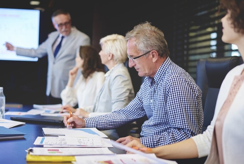 Group of business people sitting at conference table